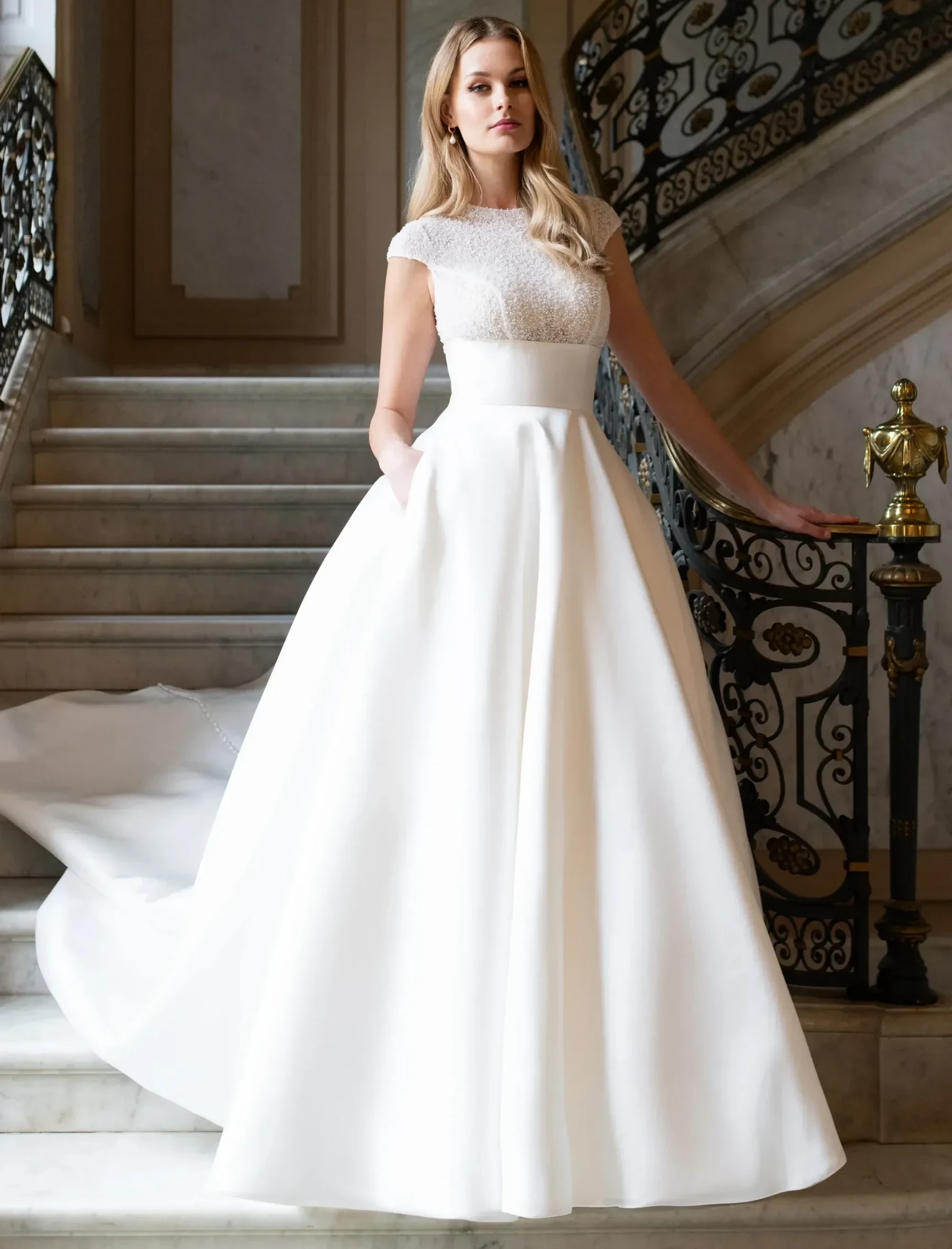 Model wearing a white gown Spring 2025 A1307