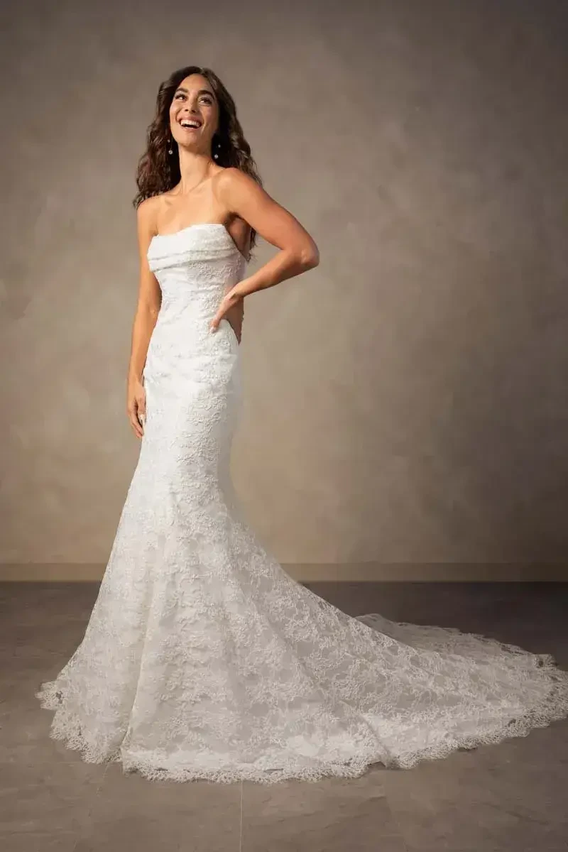 model is wearing a strapless fitted bridal gown
