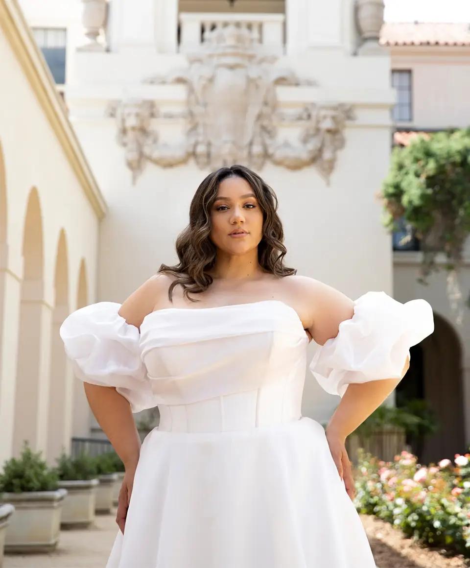 Model wearing a white gown